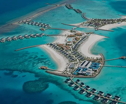 Maldives - Low-lying atoll context - sea-level exposure, coral-sand soils, dispersed island grids.